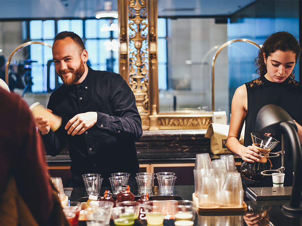 Waiters preparing drinks at the Crew Collective Cafe bar